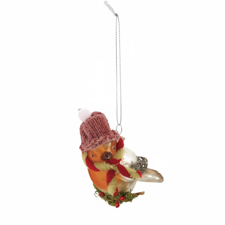 orange bird with pink hat and red and white scarf