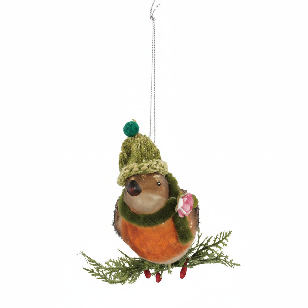 orange bird with green hat and green scarf