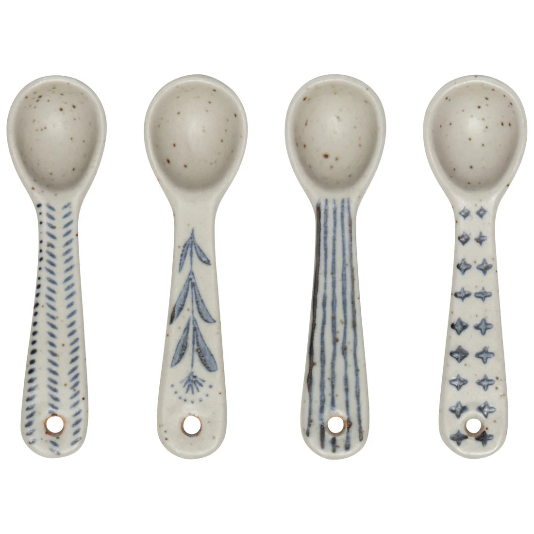four ceramic spoons in a row on a white background