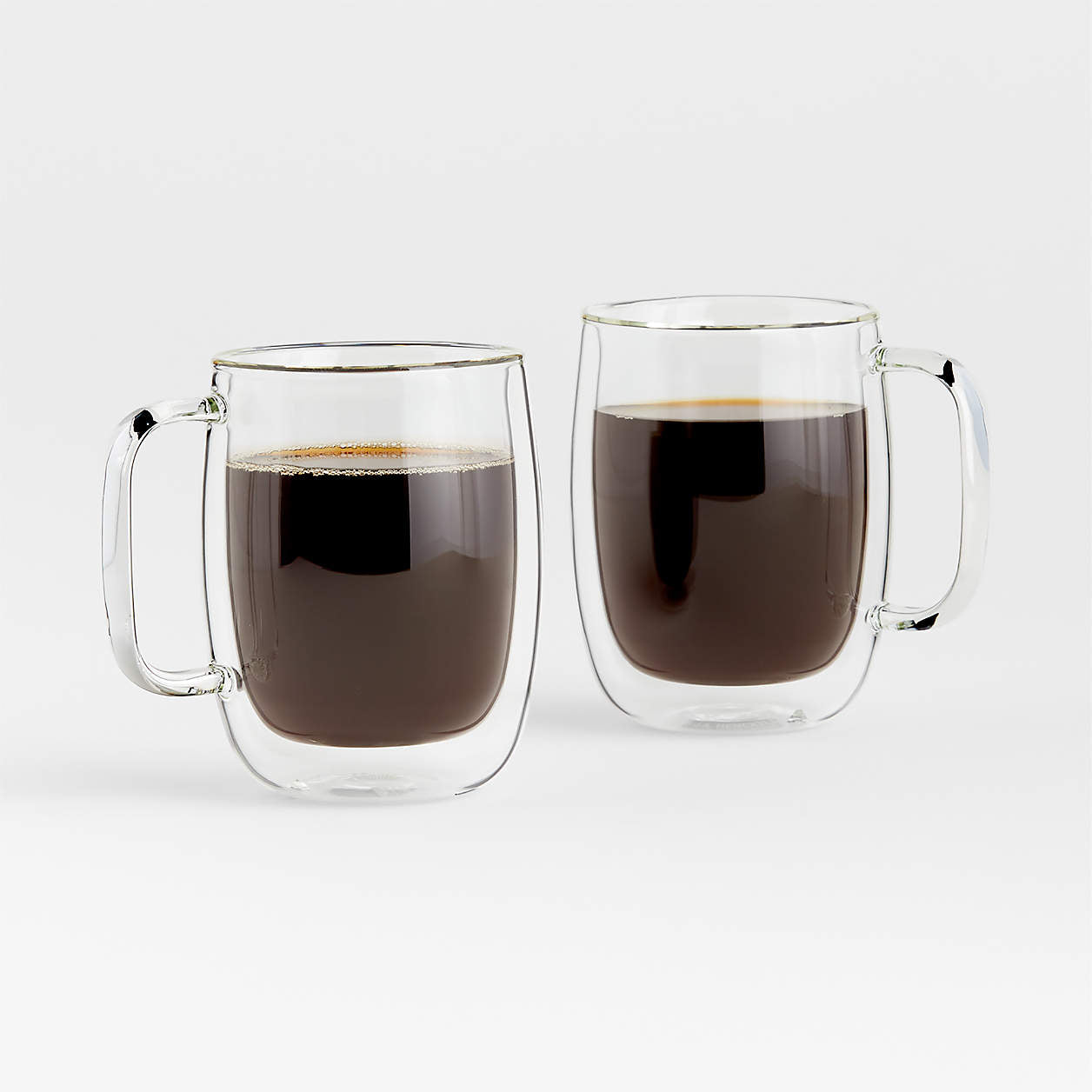 2 sorrento glass coffee mugs filled with coffee on a white background.