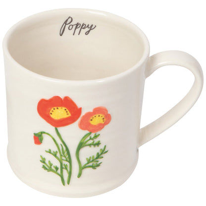 poppy embossed mug with the word "poppy" written on the upper inside of the mug