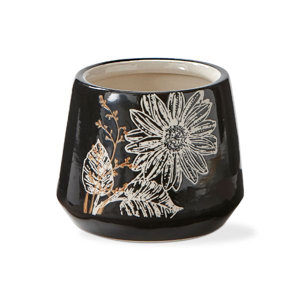 black ceramic planter with a cream interior and white and brown floral pattern.