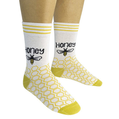 a person wearing the honey socks on a white background