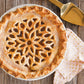 pie with lattice design cut out of pie crust top.
