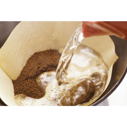 illustration of hot water being poured over coffee grounds in an unbleached number four coffee filter