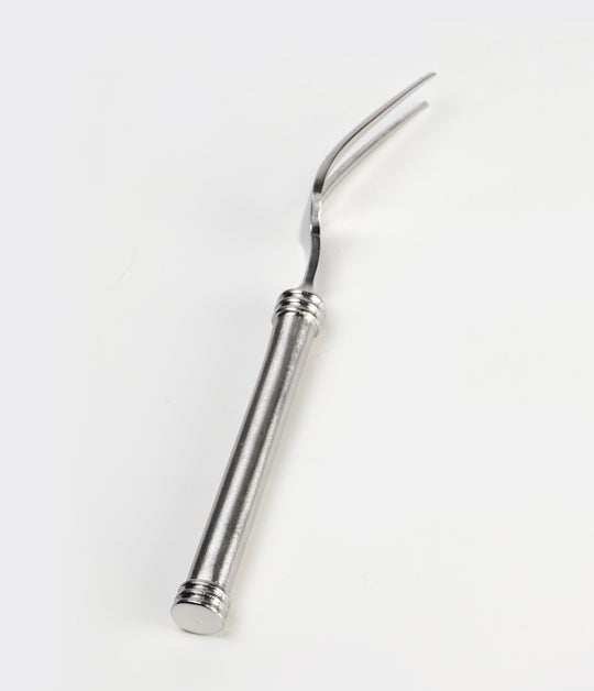 side view of stainless steel 2 prong fork on white background.