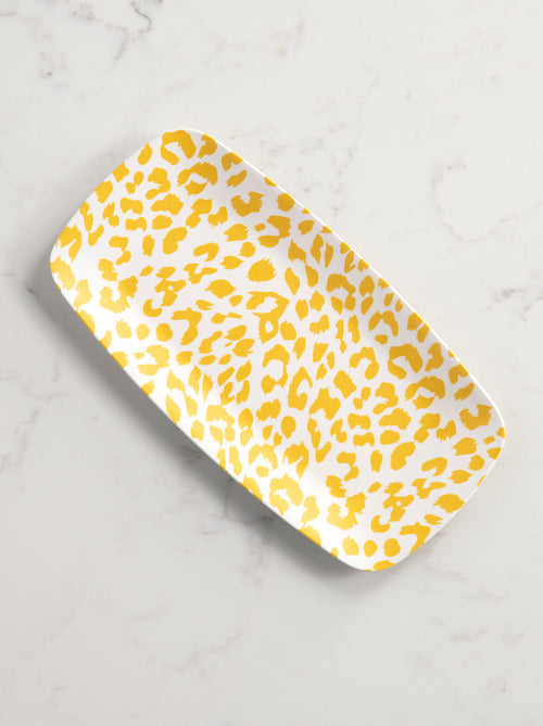 tray with yellow cheetah print on a marble background.