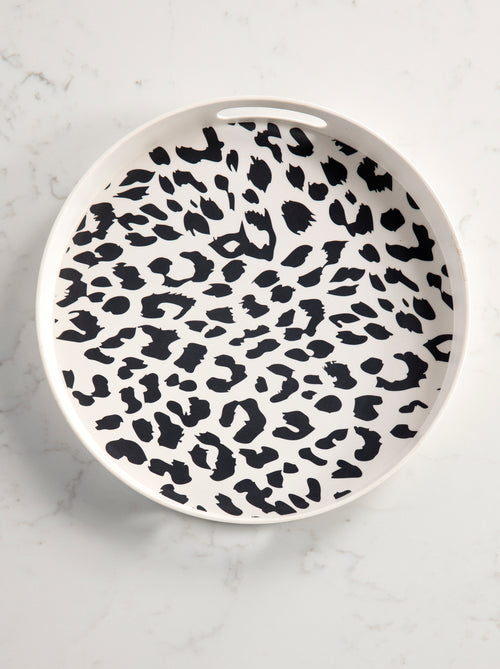 top view of tray with black cheetah print on a marble background.