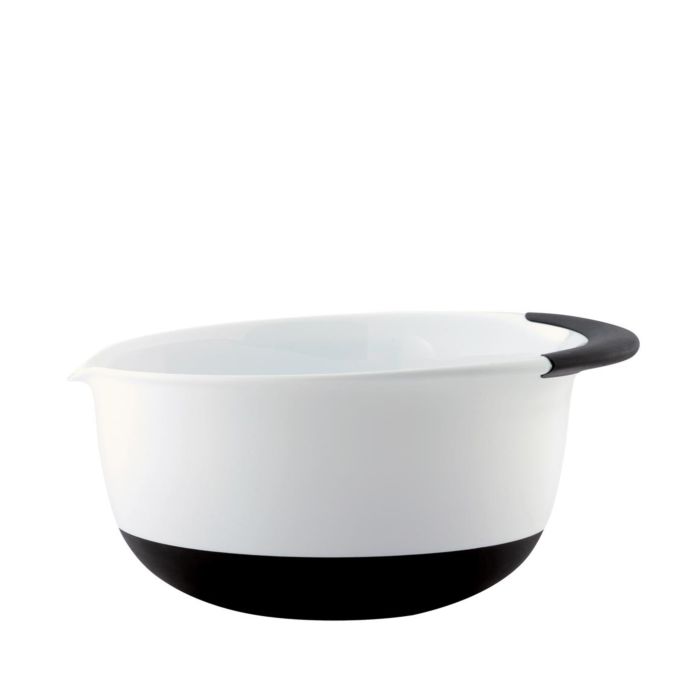 white bowl with pouring spout, black handle, and black base.