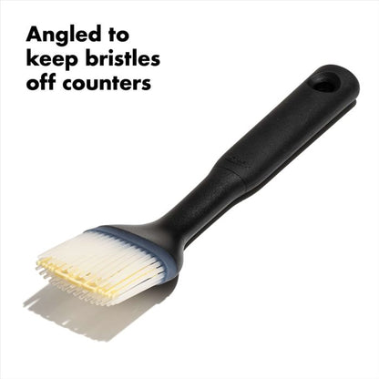 side view of brush with text "angled to keep bristles off counters".