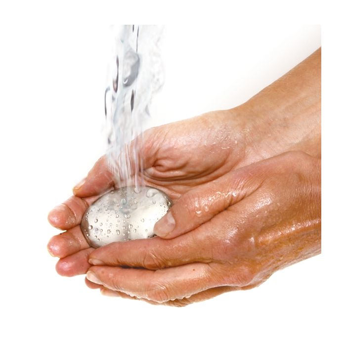 hands under running water holding odor remover.