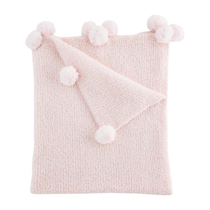 folded pink chenille blanket with pom poms on a white background