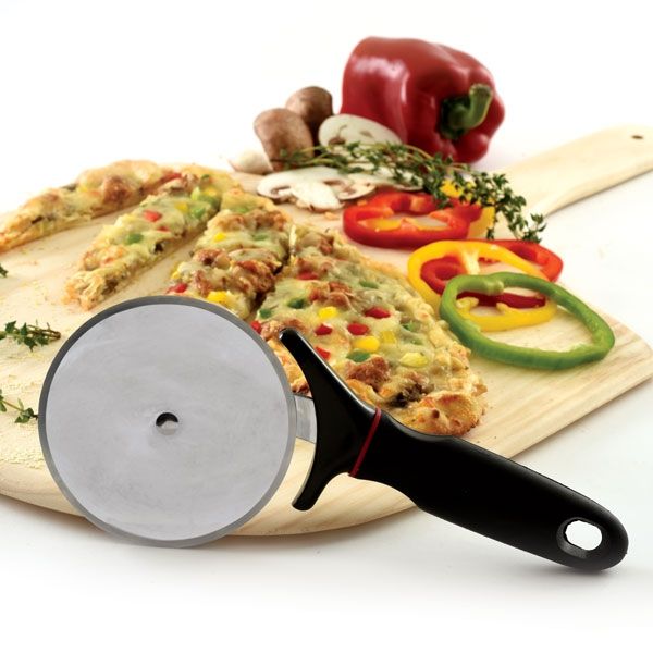 pizza wheel with cutting board and sliced pizza.