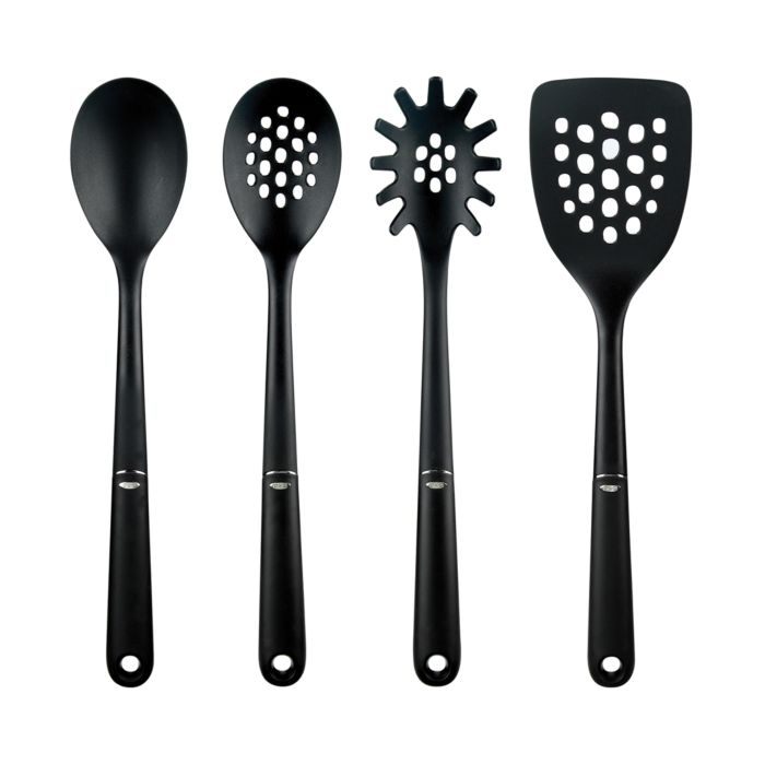 spoon, slotted spoon, pasta fork, and spatula in a row.