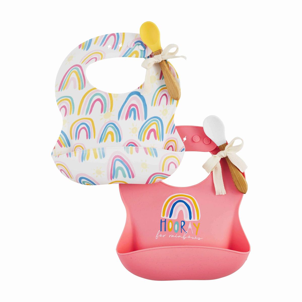 two silicone bibs with rainbow designs and a spoon tied to it.