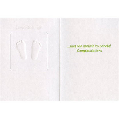 inside view of  card is white with green text reading "and one miracle to behold! congratulations"