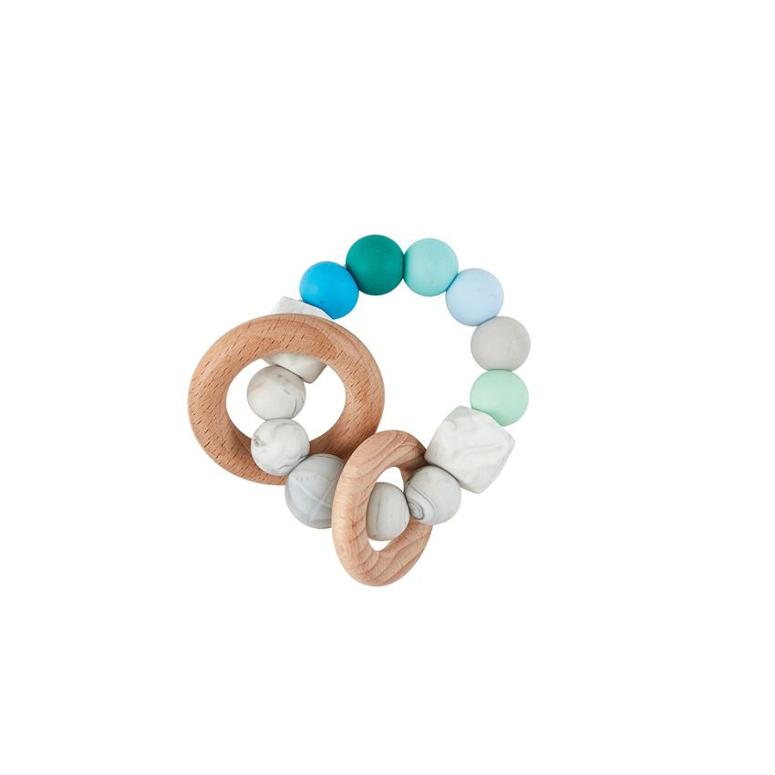 ring of silicone beads in shades of grey, blue, and green with two wooden rings on it.
