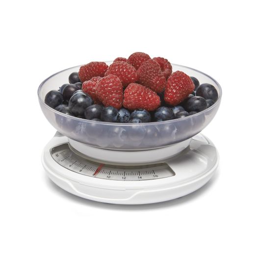 healthy portions scale bowl filled with blueberries and raspberries against a white background