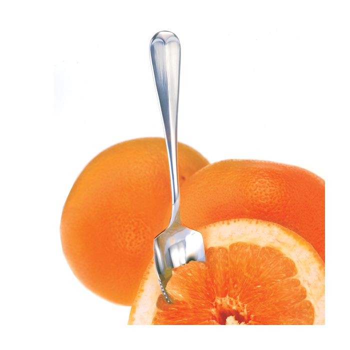 spoon digging into grapefruit.