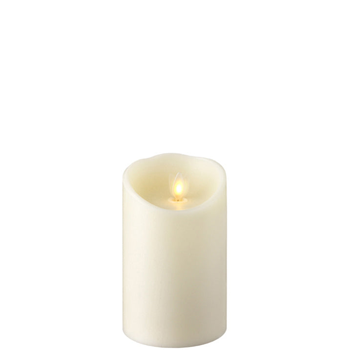 small moving flame ivory pillar candle displayed against a white background