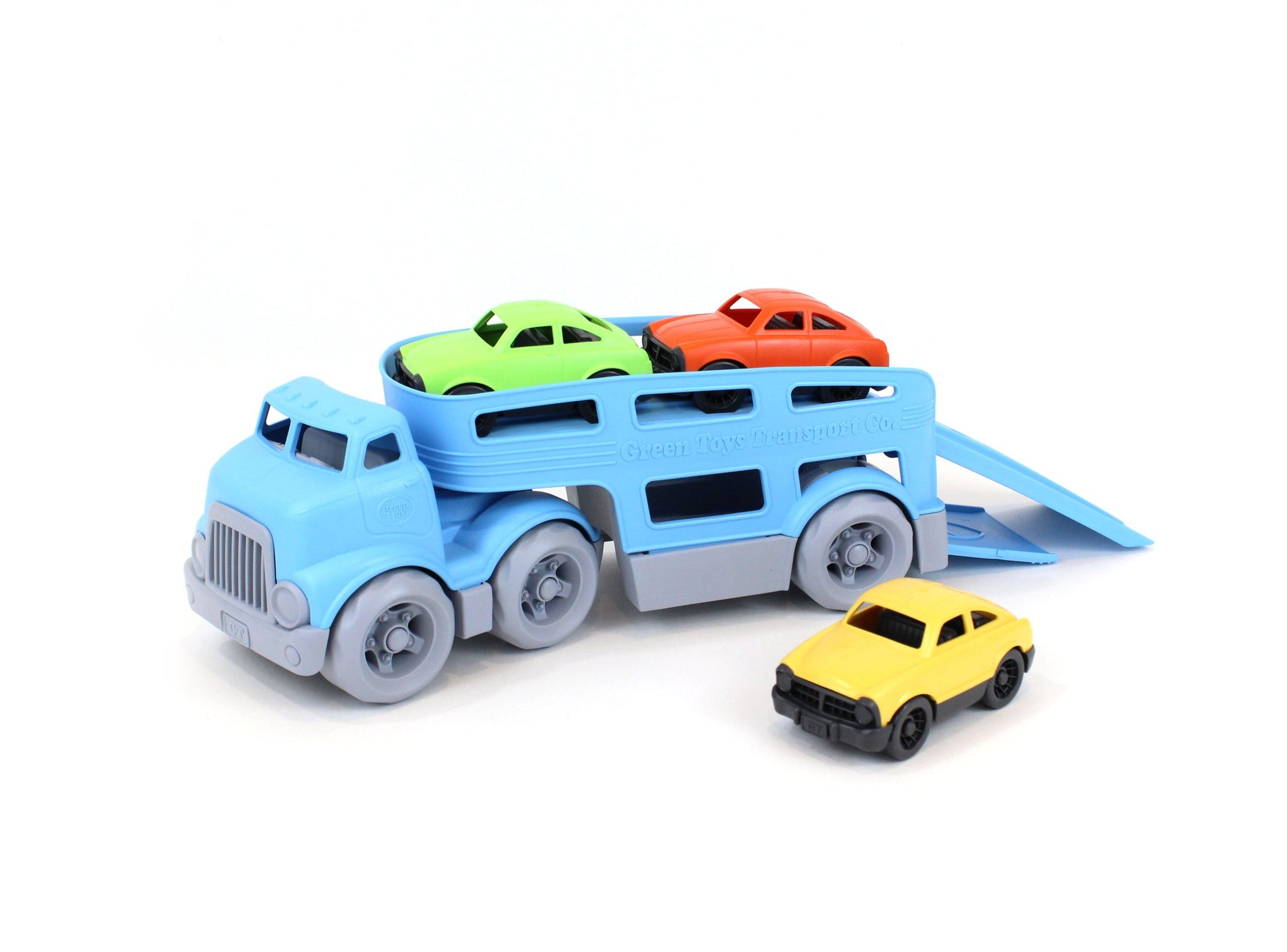 the car carrier and three cars on a white background