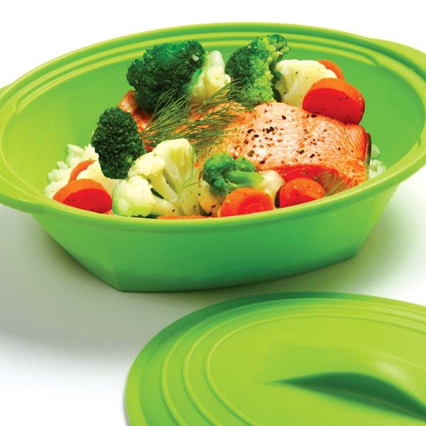 close-up of steamer bowl filled with veggies and fish.
