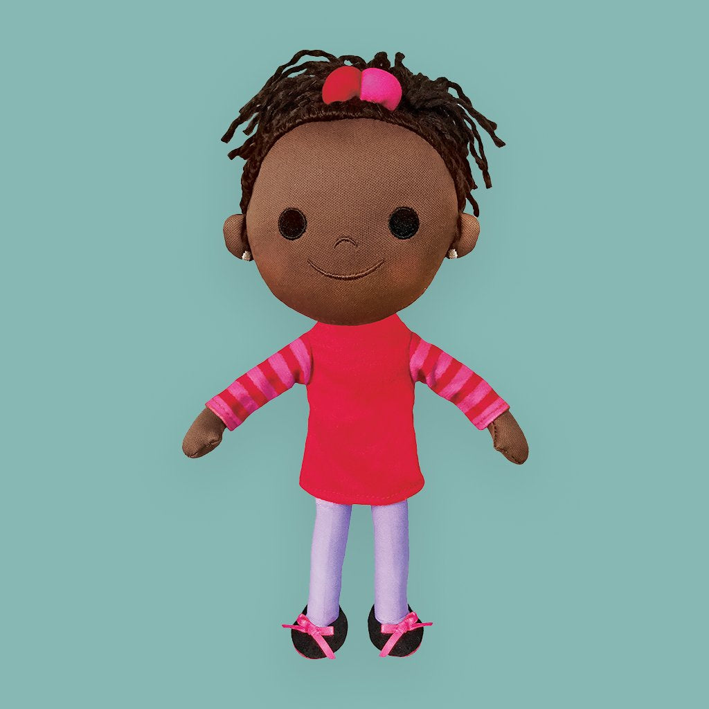 islandborn plush toy on a turquoise background