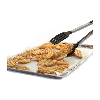 spatula tongs picking up waffle fries from baking tray.