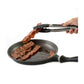 tongs picking up bacon from fry pan.
