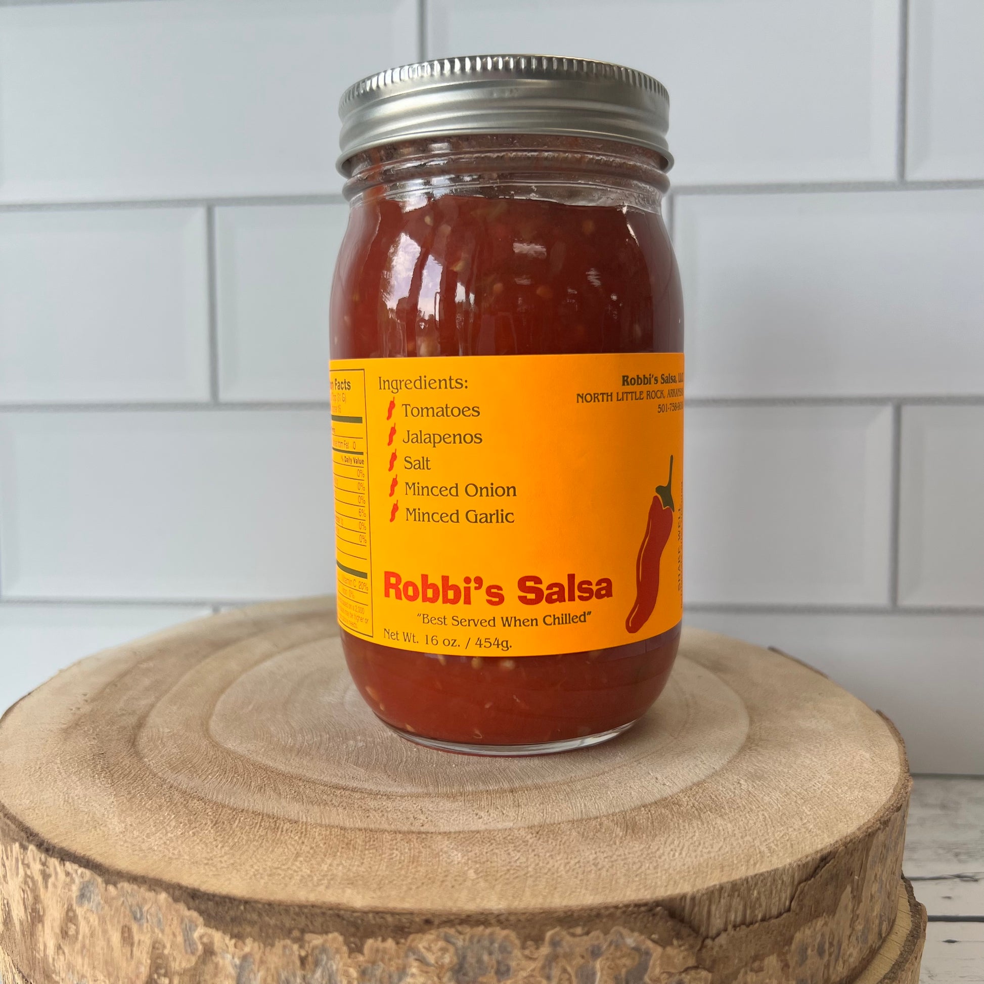 Jar of Robbie’s salsa on a countertop.