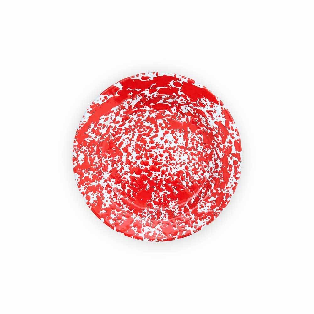 red dinner plate on a white background