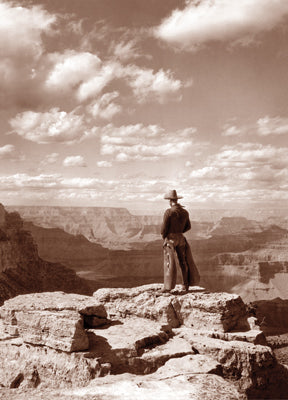 front of card is a photo of a cowboy overlooking the grand canyon