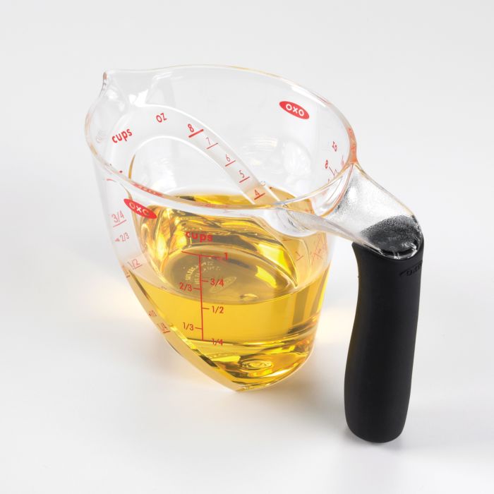 measuring cup with oil in it.