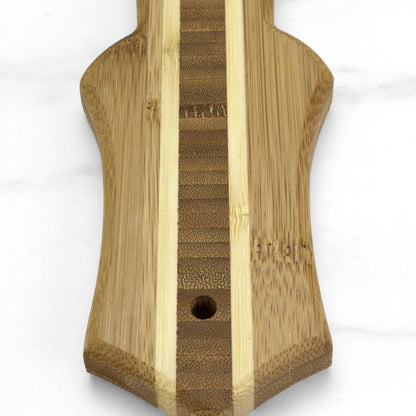 close-up of narrow end of ukulele shaped board.