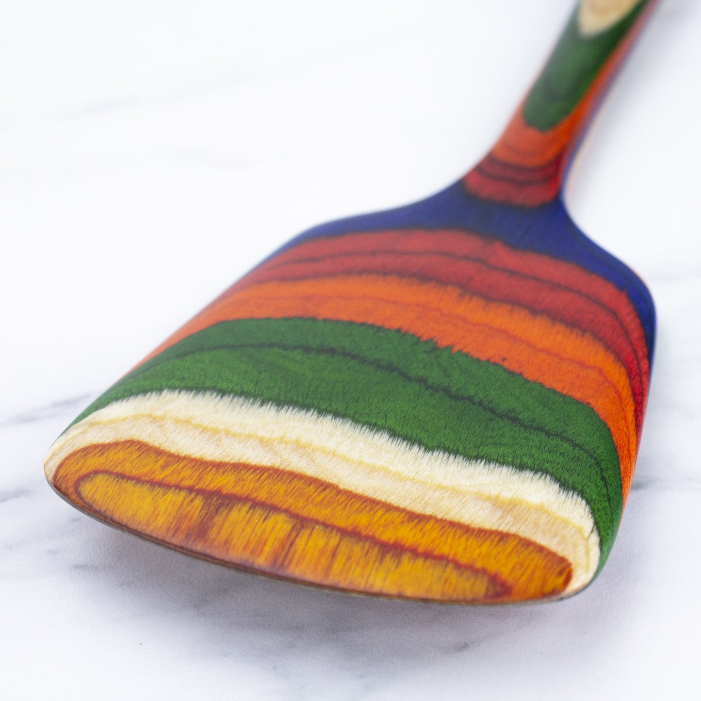 close-up view of spatula on white background.