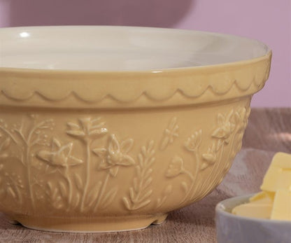 close-up of floral design on yellow bowl.