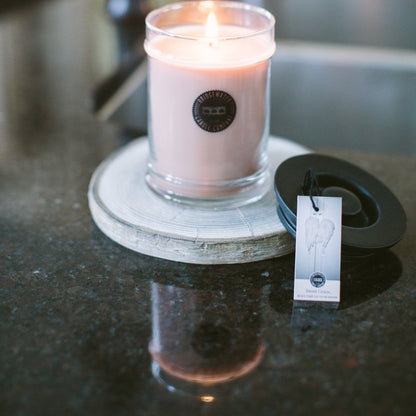 sweet grace candle on a black counter