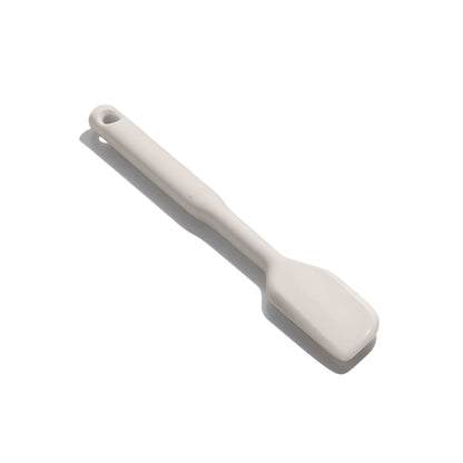 angled view of the small silicone spatula on a white background