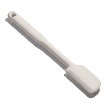 close up angled view of the silicone jar spatula on a white background