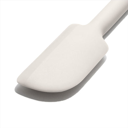 close up view of the spatula end on a white background