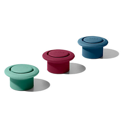 green, red, and blue silicone stoppers.