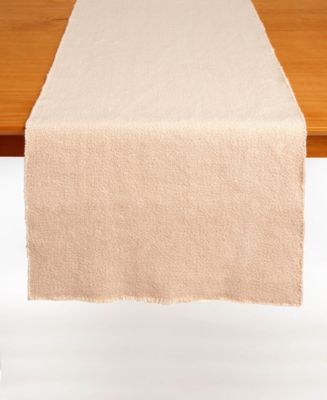 blus table runner hanging over wooden table.