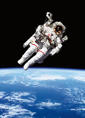 photograph of astronaut floating in space with planet in background