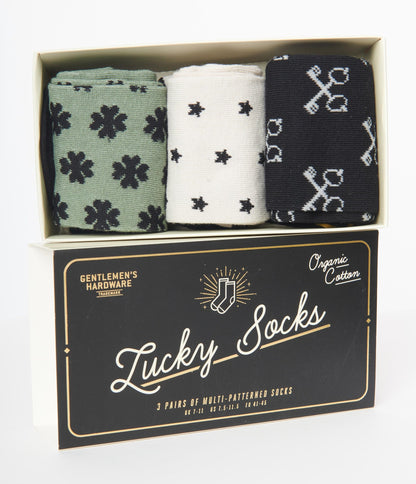 packaging box for gentlemen's hardware lucky socks with 3 pairs of multi-patterned socks rolled up inside of the box.