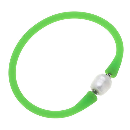neon green bali freshwater pearl silicone bracelet on a white background