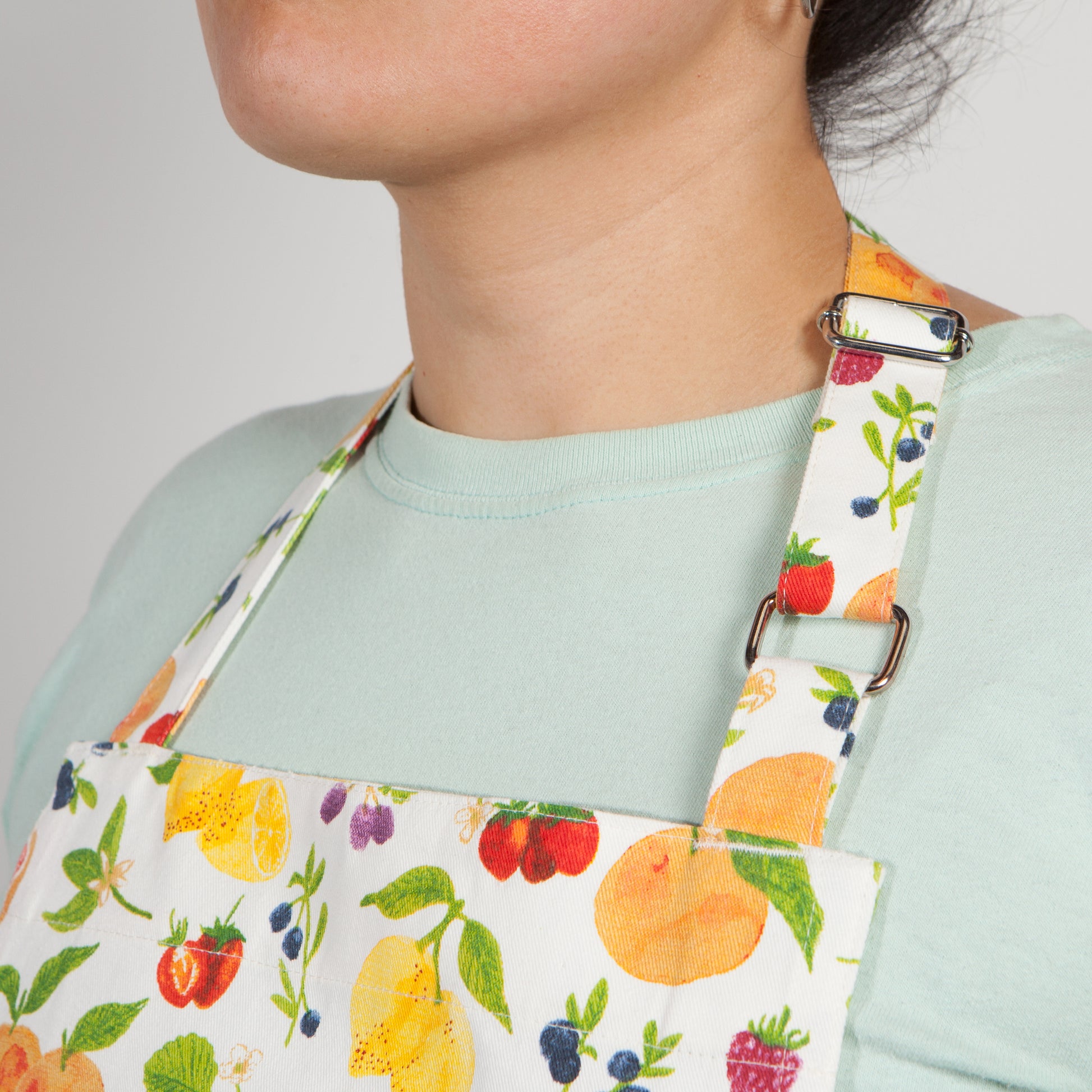 close-up of neck strap on person wearing apron.