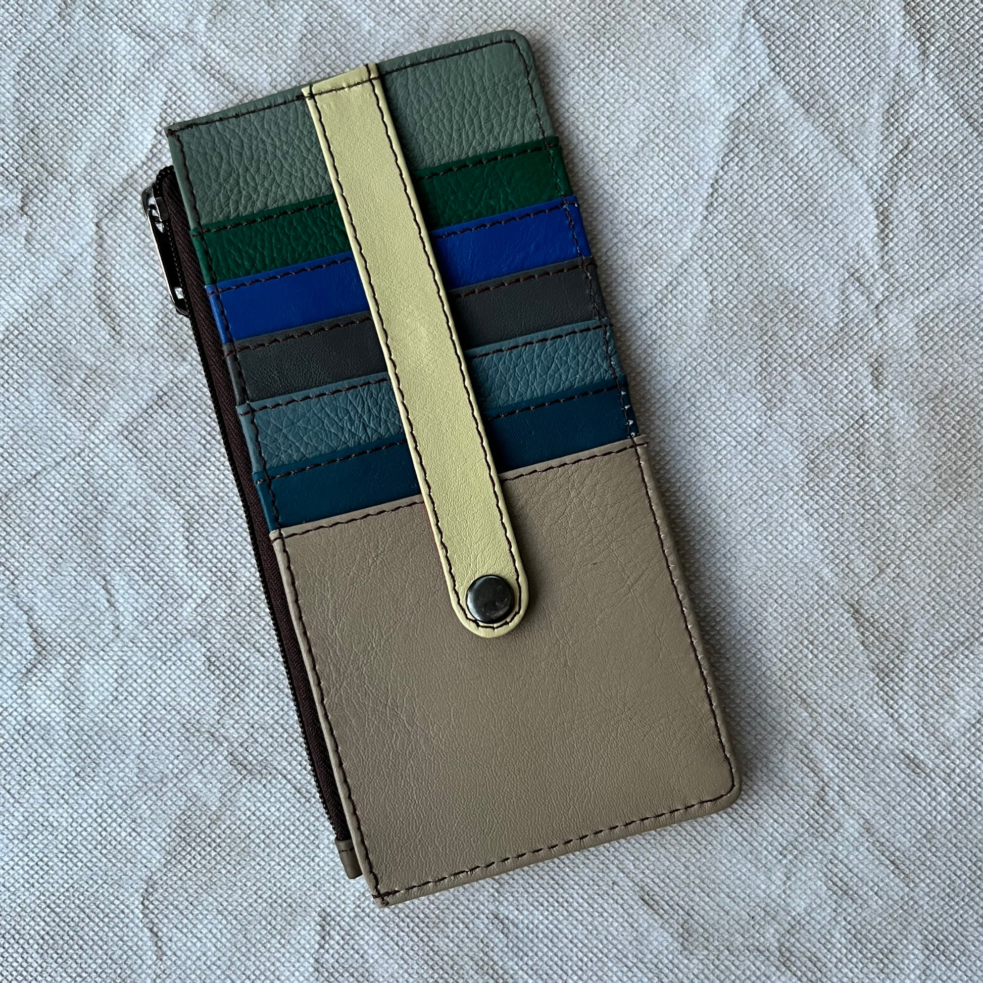 card holder with colorful card slots, snap tab, and side zipper pocket.