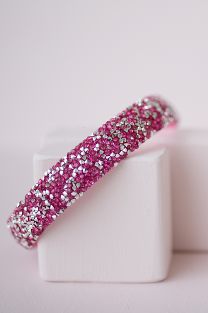 the pink gummy glitter boutique headband on a pale pink background