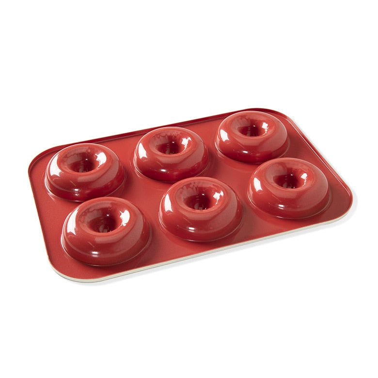 red donut pan with 6 donut wells.
