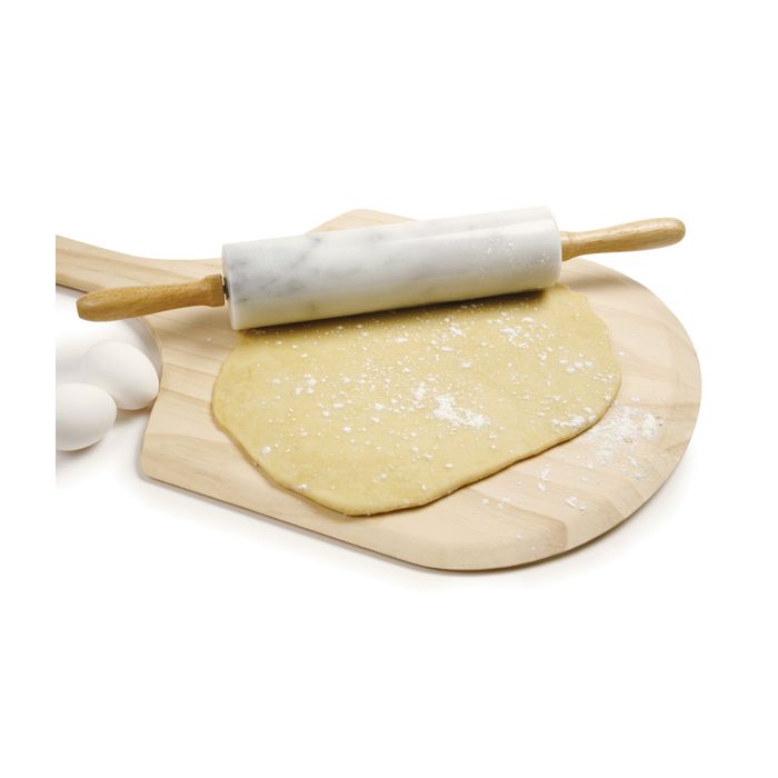 marble rolling pin on board with rolled out dough.